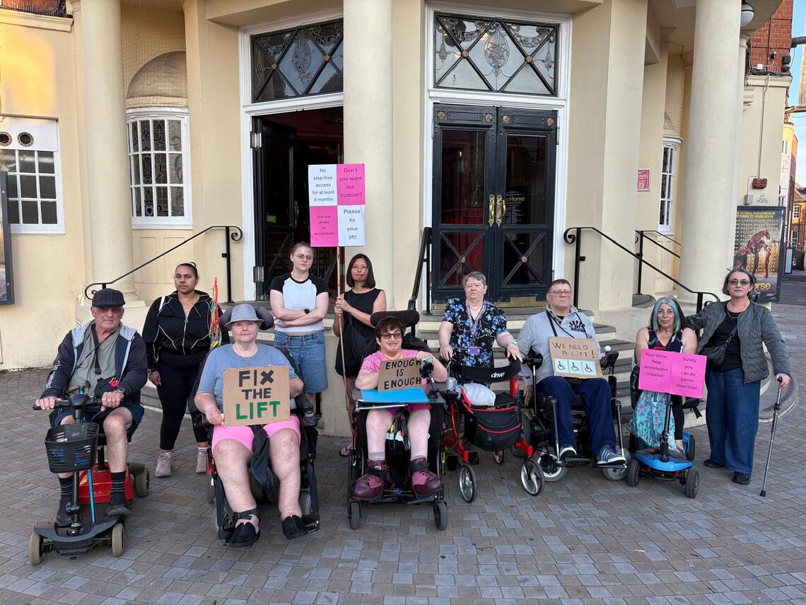 Access Champions Outside New Wimbledon Theatre