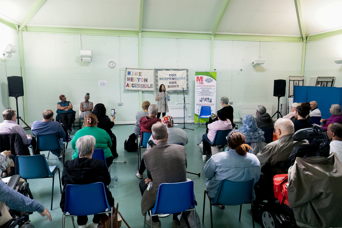 Image of back of crowd at Merton CIL event 