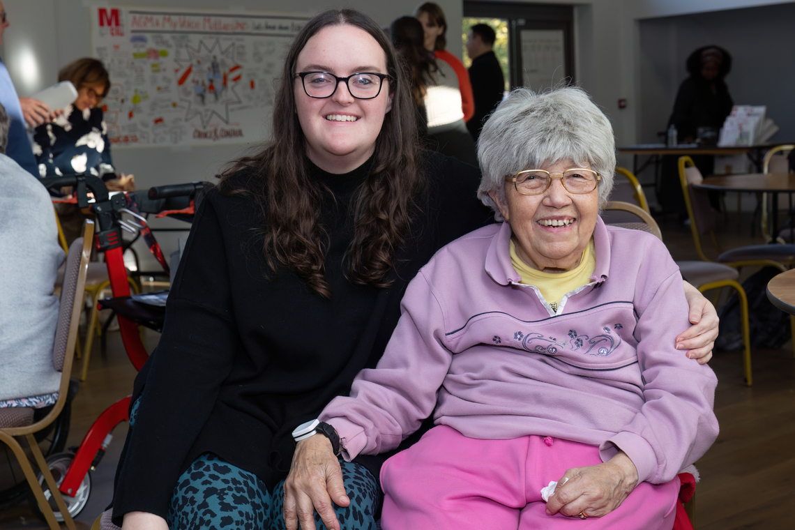 Lauren and member at AGM 2025