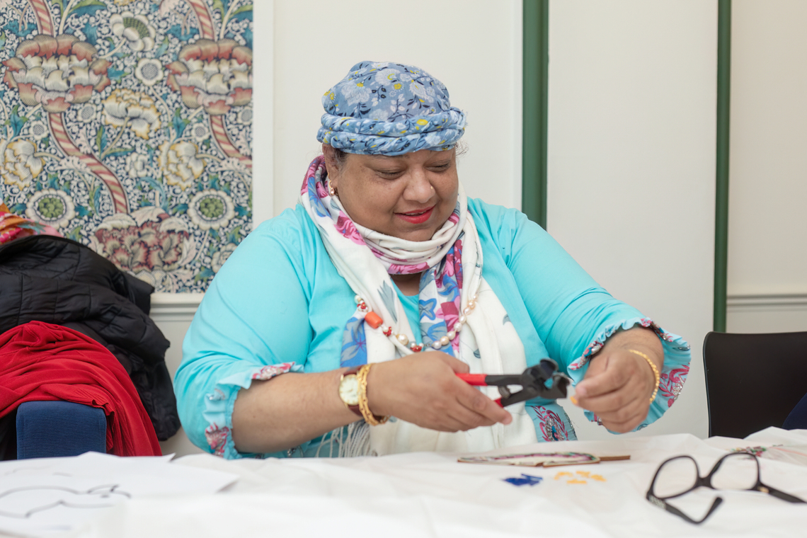 Merton CIL Member at Craftivism and Chat making a mosaic