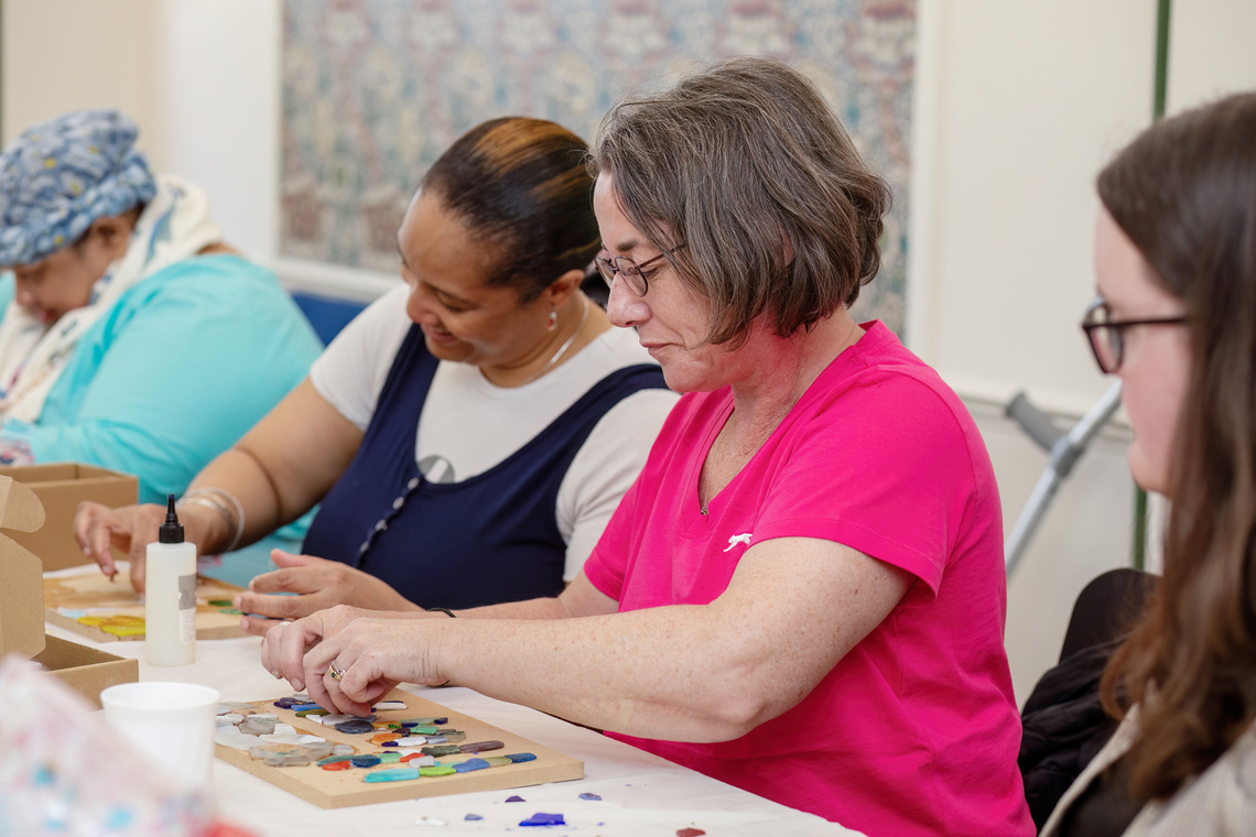 People at Craftivism and Chat using mosaic materials